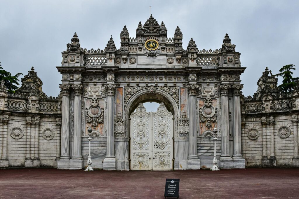 The entrance to a large building with a clock